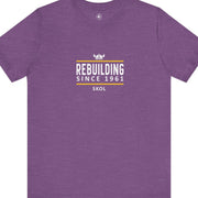 Purple t-shirt with white and yellow text that says, Rebuilding Since 1961