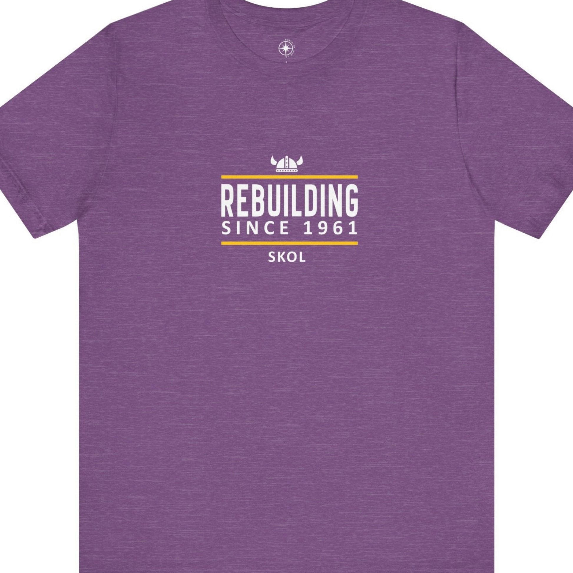 Purple t-shirt with white and yellow text that says, Rebuilding Since 1961