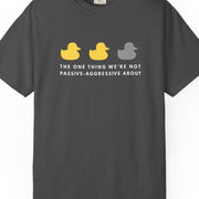 Gray t-shirt with colorful graphic and text The One Thing We're Not Passive-Aggressive About