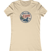 A beige short-sleeve crewneck t-shirt featuring a circular vintage-style graphic on the chest with a loon illustration and the text 'Leave Me Loon'.