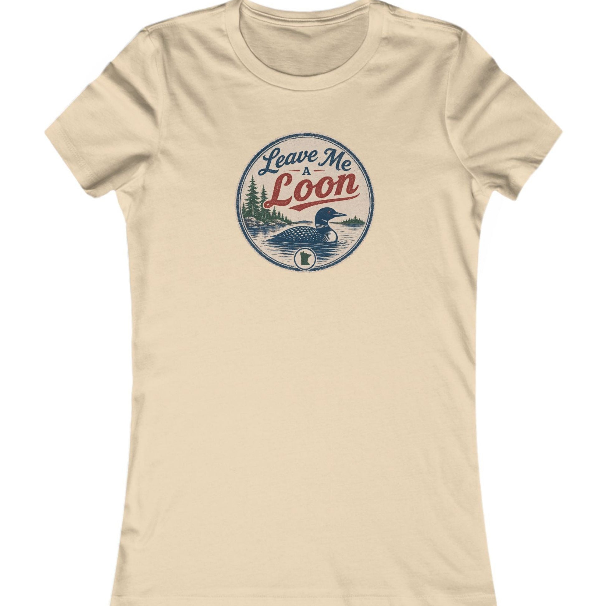 A beige short-sleeve crewneck t-shirt featuring a circular vintage-style graphic on the chest with a loon illustration and the text 'Leave Me Loon'.