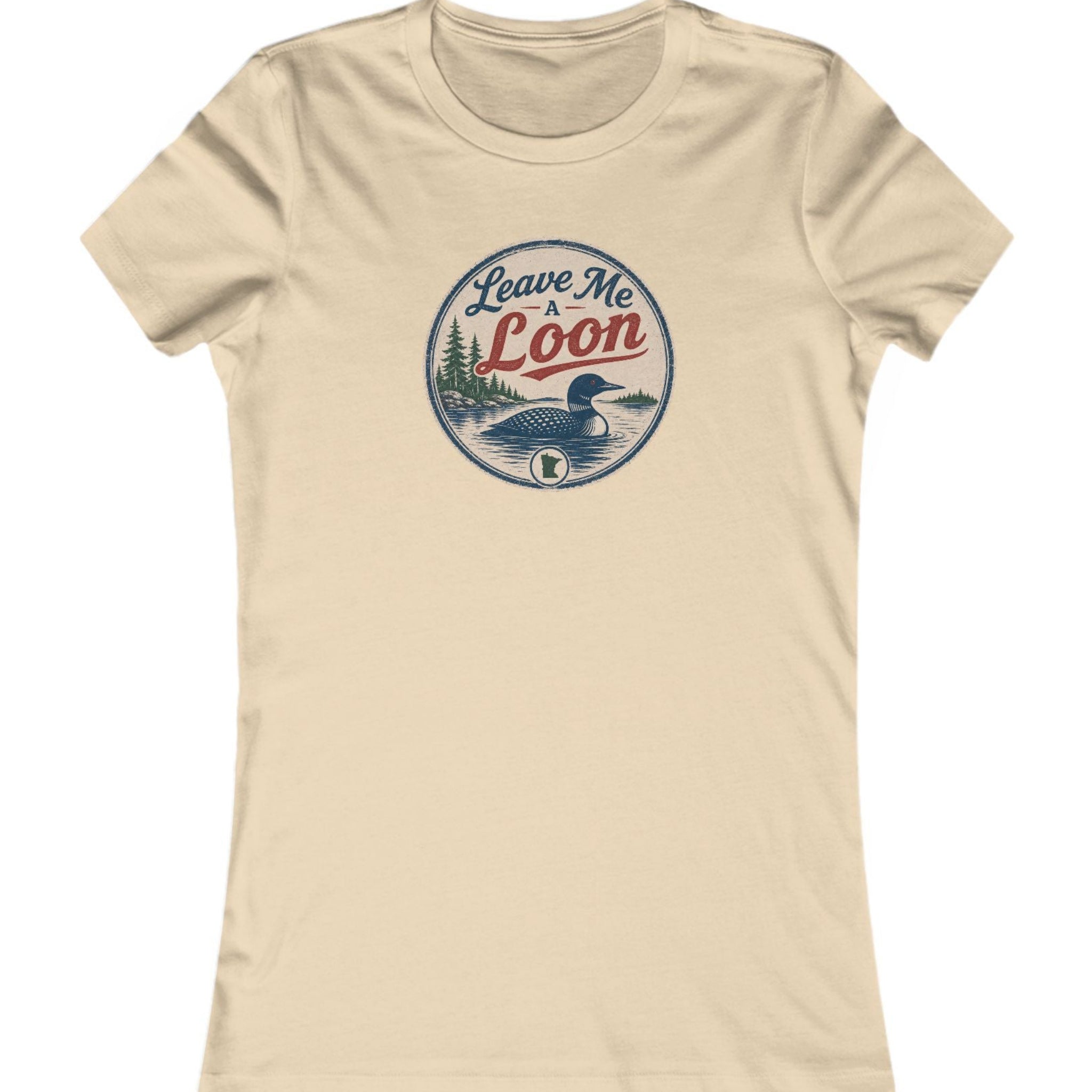 A beige short-sleeve crewneck t-shirt featuring a circular vintage-style graphic on the chest with a loon illustration and the text 'Leave Me Loon'.