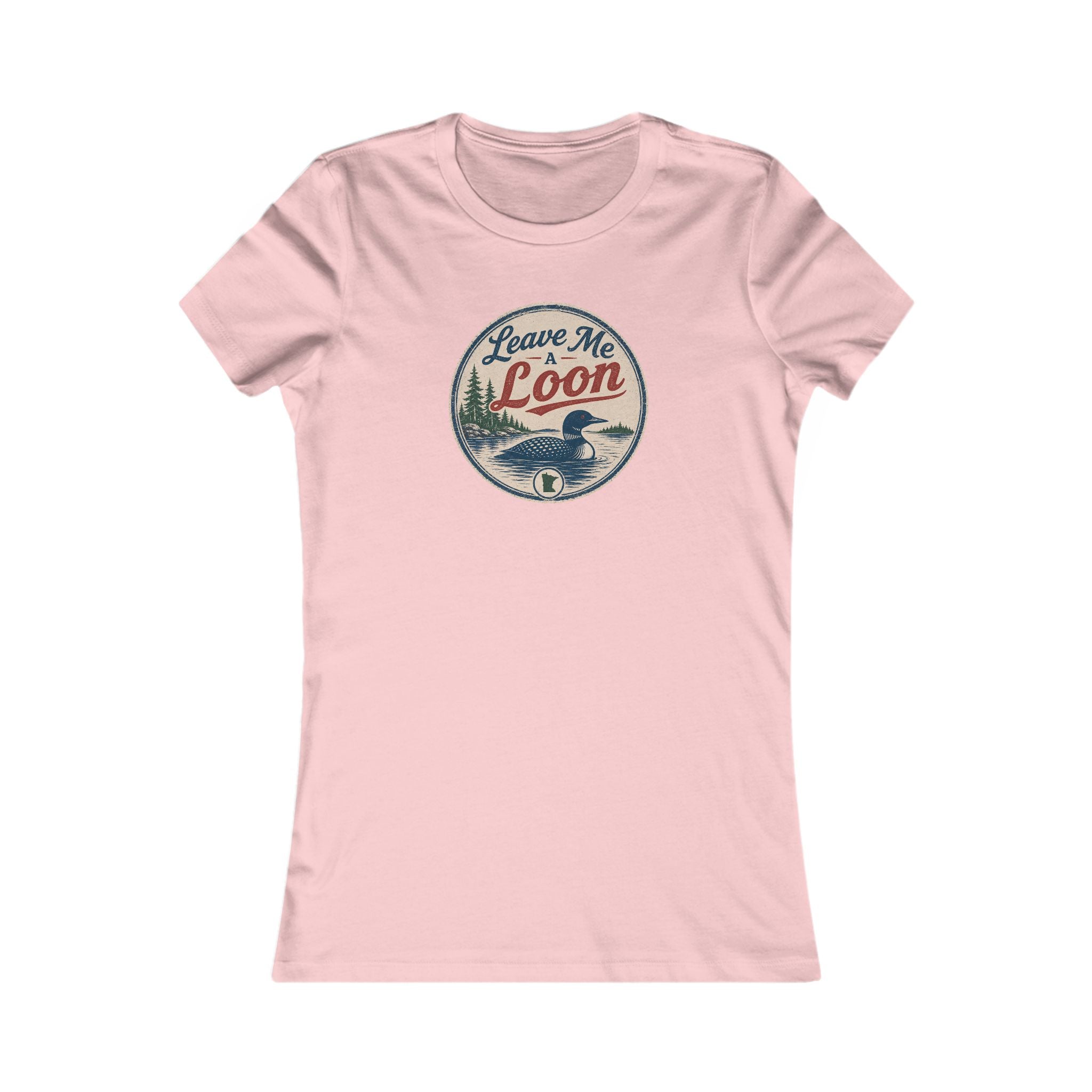 A light pink short-sleeve crewneck t-shirt with a circular vintage-style graphic on the chest featuring a loon duck and the text 'Leave Me Loon'.