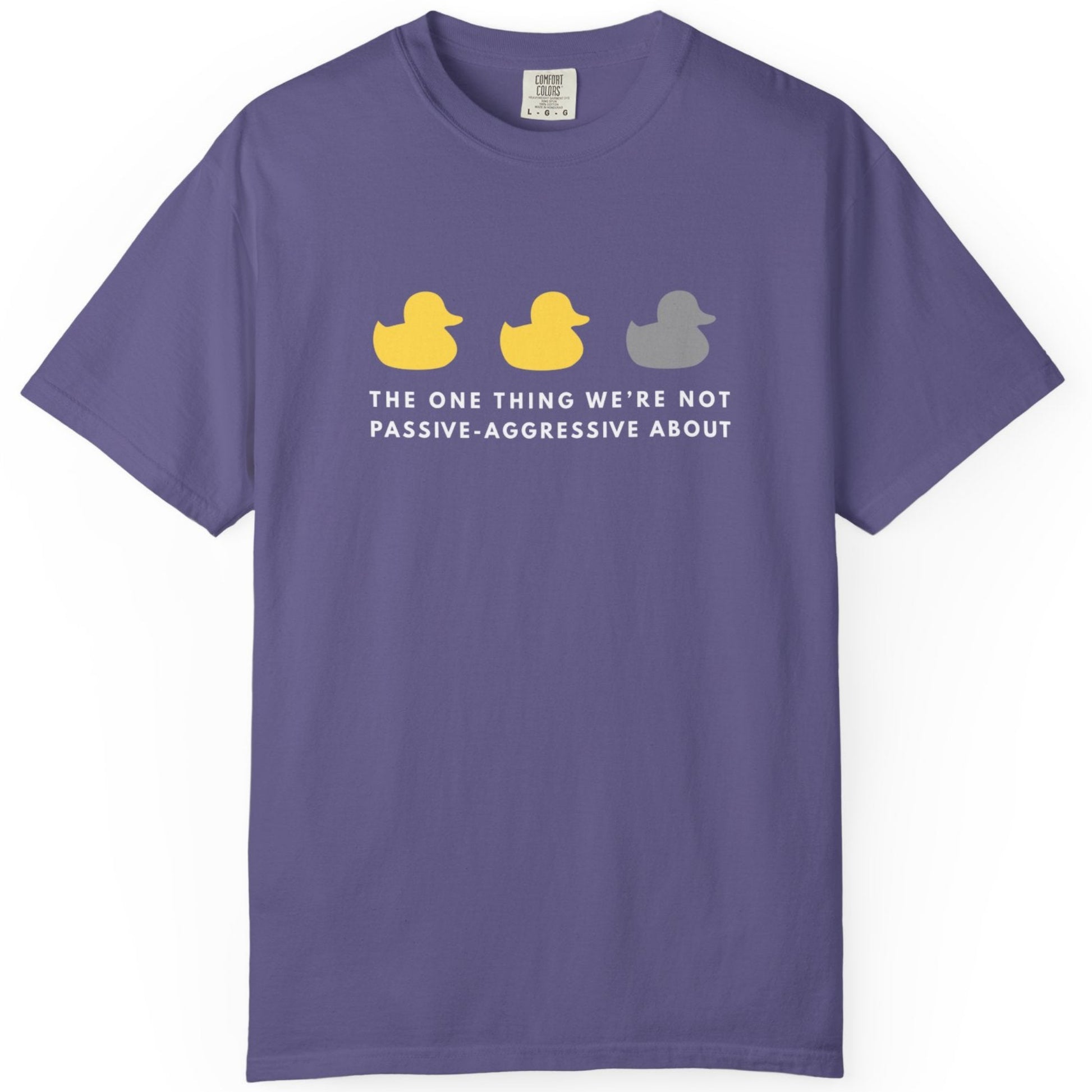 Purple t-shirt with colorful rubber duck graphic and text The one thing we're not passive-aggressive about